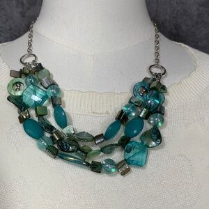 Add a touch of color and elegance to your outfit with this long beaded necklace.